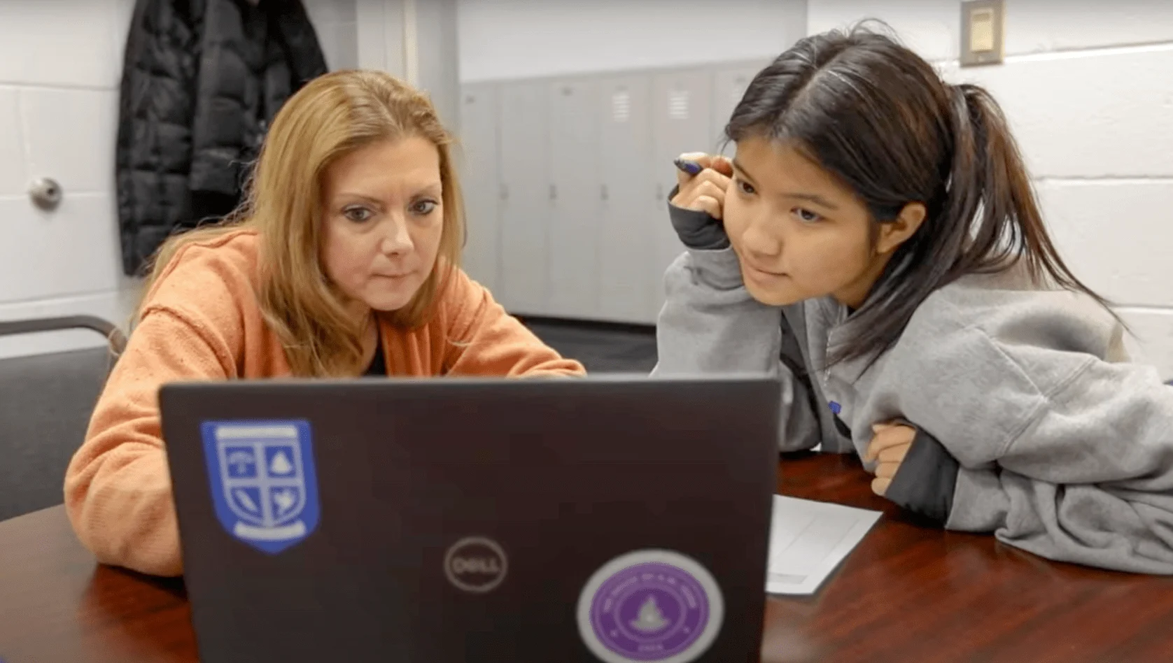 Academic-Support middle school students work independently at tables in a classroom